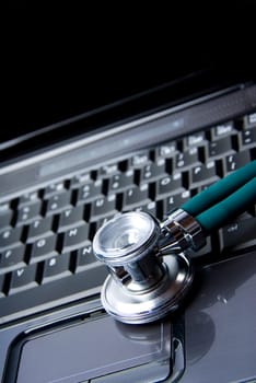 Stethoscope and laptop isolated on white backgound