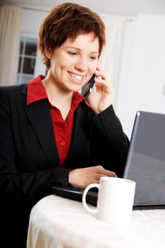 woman on the phone and laptop at the same time