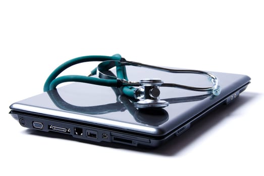 Stethoscope and laptop isolated on white backgound