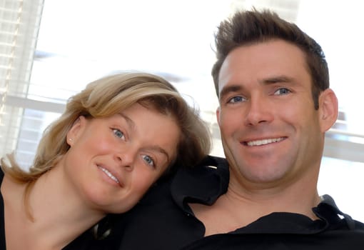 happy couple in love with woman leaning on shoulder