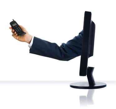 A hand sticking from a monitor with a cell phone