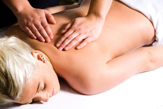 woman getting a good massage at a day spa