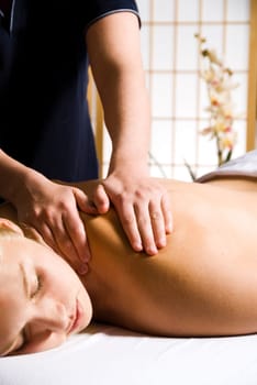 woman getting a good massage at a day spa