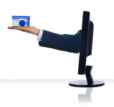A hand sticking out froma monitor with a gift