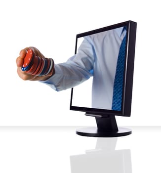 A hand holding some casino chips from monitor