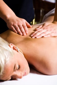woman getting a good massage at a day spa