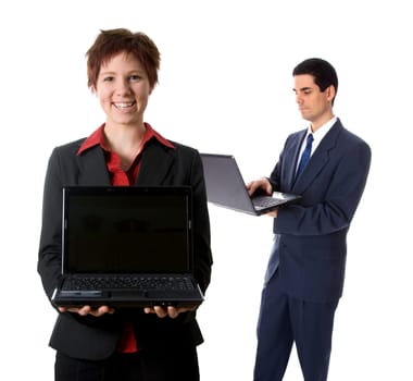 woman in black jacket holding a laptop with man in background