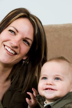 mom happy with their baby boy blue eyes