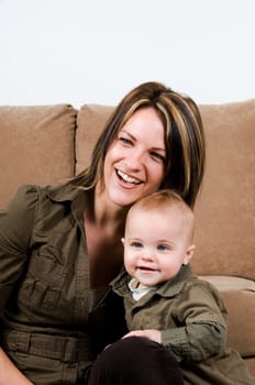 mom happy with their baby boy blue eyes