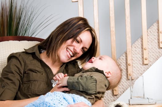 mom resting in a chair with her baby