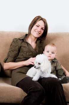 mom resting in a sofa with her baby