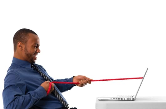 business man pulling a rope through his laptop
