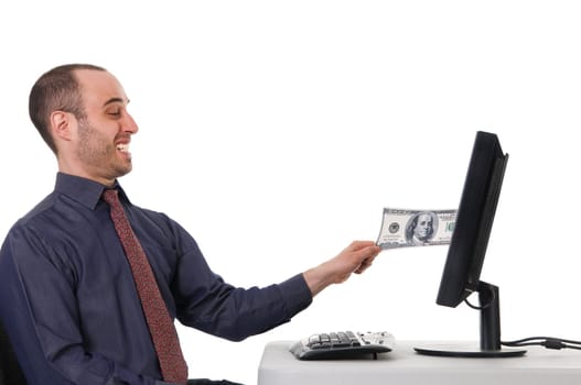 business man pulling his money from a monitor