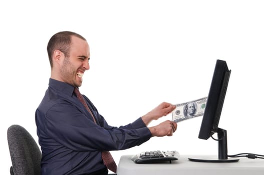 business man pulling his money from a monitor