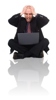 business man in a panic over the black laptop