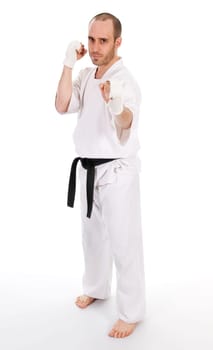 White man doing martial arts on isolated background