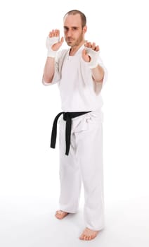 White man doing martial arts on isolated background