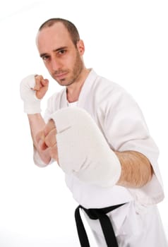 White man doing martial arts on isolated background