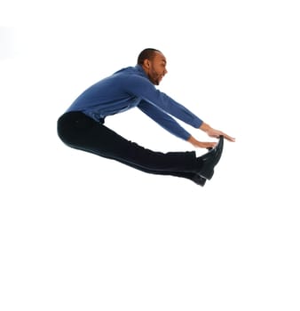 young attractive male dancer doing the jump