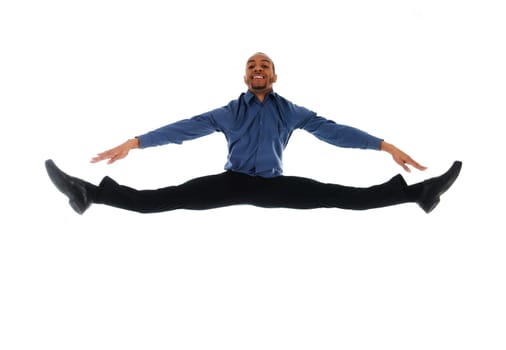 young attractive male dancer doing the splits