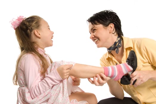 mom and daughter playing dress-up on white background