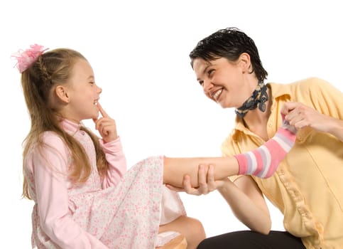 mom and daughter having fun plying dress-up