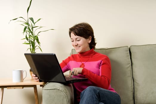 woman on laptop computer on couch