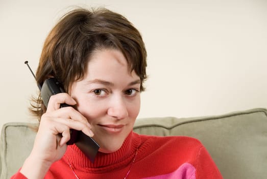 woman on the phone staring seductively at camera