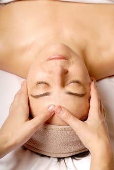 woman getting a facial at a spa