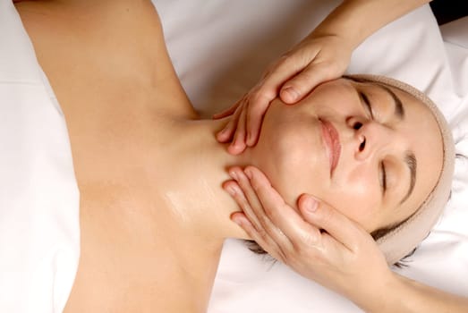 female getting a facial treatment at a spa