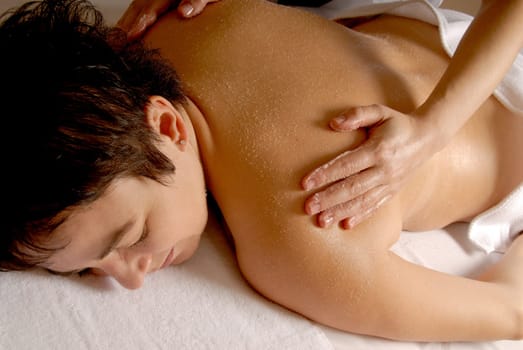 woman getting a salt glow at a spa