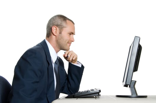 man in blue suit looking at lcd monitor