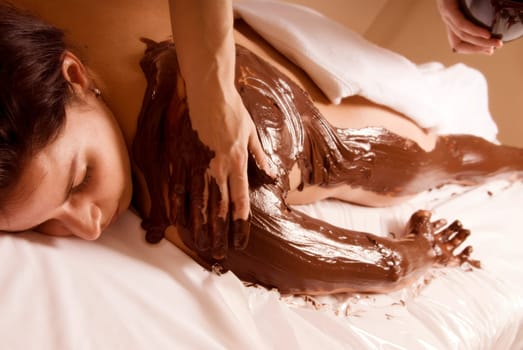 woman getting a chocolate rub at a local spa