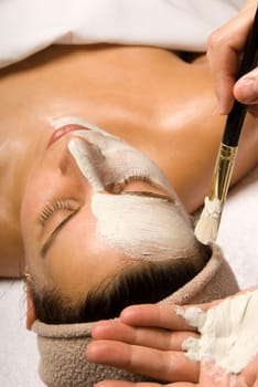 woman getting a facial at a day spa