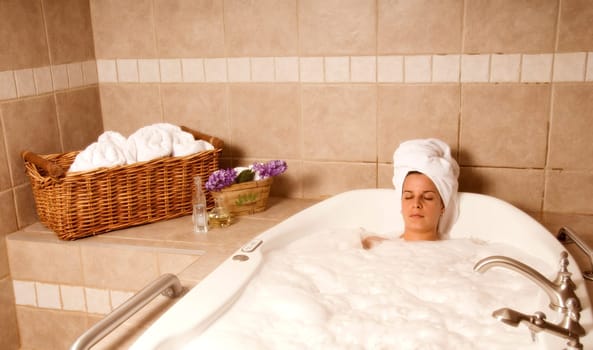 cute girl in a spa bath relaxing