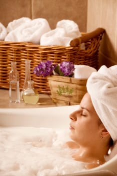 cute woman in a bath in a local spa