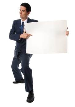 businessman in blue suit holding a white card