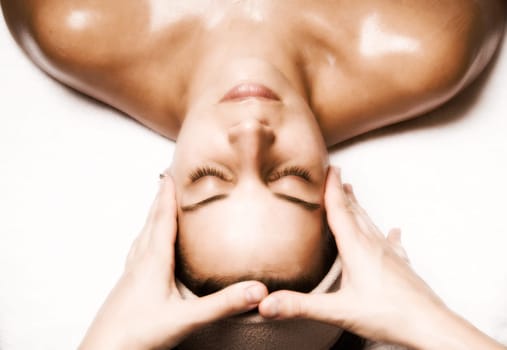 woman relaxing with a nice facial massage