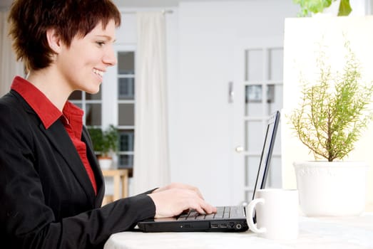 woman in a suit working from home