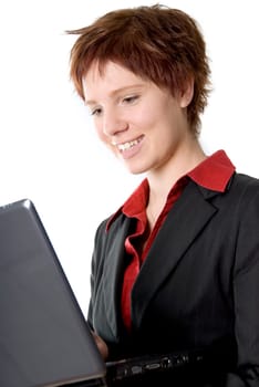 smiling girl holding a grey laptop in her hand