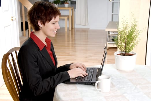 woman in a black suit working from home