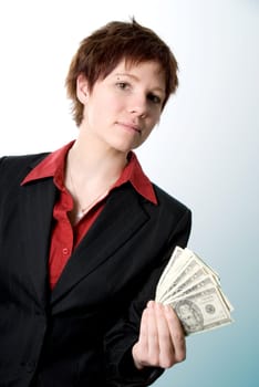 serious woman in business attire holding some cash