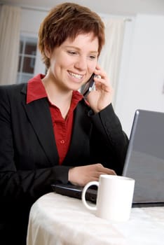 woman on the phone and laptop at the same time