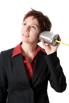 woman in a suit listening to a tin can phone