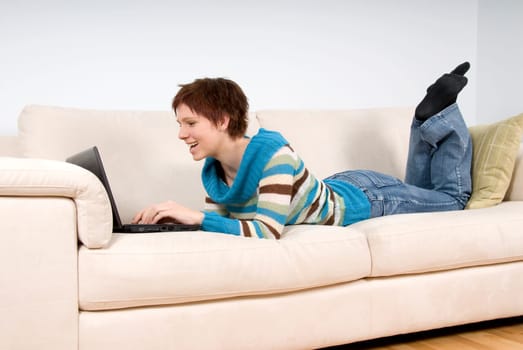 happy woman on her couch in the livingroom