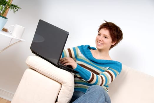 cute woman in casual dress with her laptop