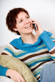 cute girl on the phone on the sofa