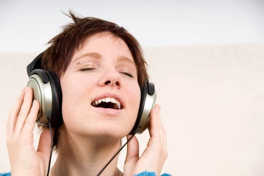 cute portrait of a woman listening to music