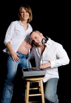 man mixing music to baby's heart beat