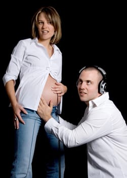 young future parents listening to the womb